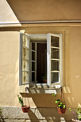Image showing opened window with flowerpots