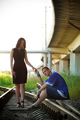 Image showing couple on rails