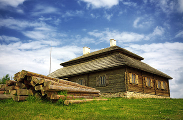 Image showing wooden cottage on green hill