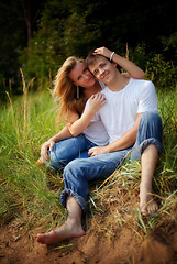 Image showing couple embrace in high grass