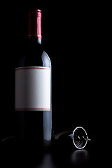 Image showing bottle of red wine and corkscrew