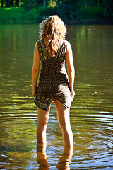 Image showing girl stand in river