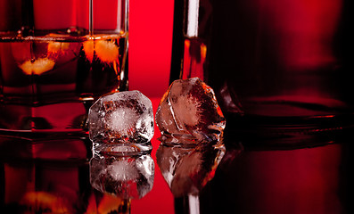 Image showing two ice cube and whiskey