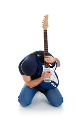 Image showing rocker playing guitar kneeling
