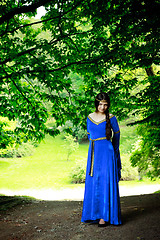 Image showing beautiful princess in shadow of big trees