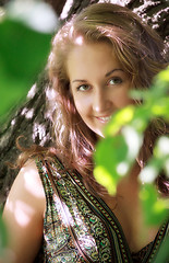 Image showing girl standing in shadow of leaves