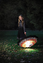 Image showing girl with umbrella in autumn park