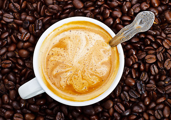 Image showing espresso cup in coffee beans