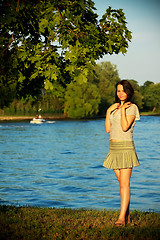 Image showing cute girl on river coast