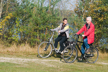 Image showing Seniors on a bike