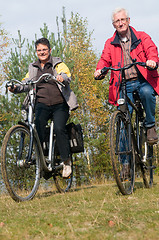 Image showing Seniors on a bike