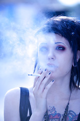Image showing smoking girl in gothic style