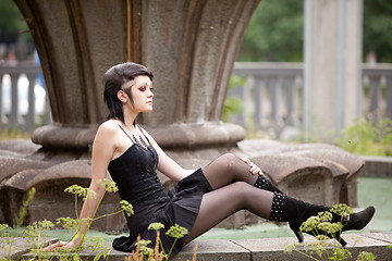 Image showing girl in gothic style near old fontane