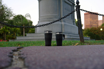 Image showing Two black travel mugs
