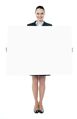 Image showing Confident young executive with an advertising board