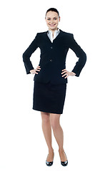 Image showing Female executive posing with hands on her waist