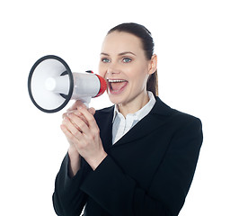 Image showing Pretty lady giving instructions with megaphone