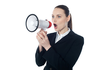 Image showing Business woman giving instructions with megaphone