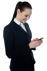 Image showing Corporate lady reading sms