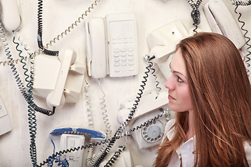 Image showing woman with vintage phones
