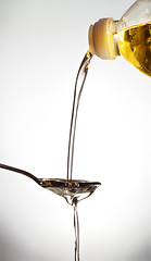 Image showing pouring oil