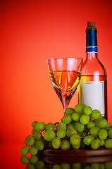 Image showing bottle and glass of wine, grape bunch