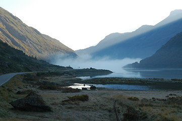 Image showing Sunrise over misty lake