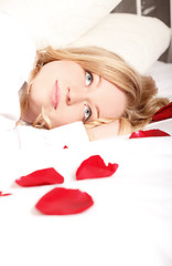 Image showing Woman In Bed With Rose Petals