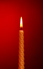 Image showing Candle On Red