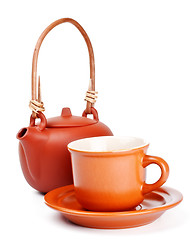 Image showing clay kettle and cup with saucer