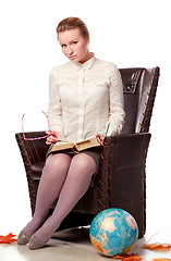 Image showing serious teacher sitting in armchair