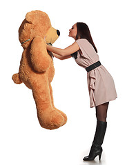 Image showing beautiful girl kissing toy bear