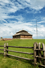 Image showing wooden cottage on green hill