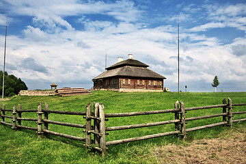 Image showing wooden cottage on green hill