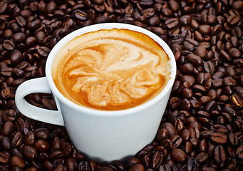 Image showing espresso cup in coffee beans