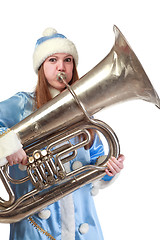 Image showing funny santa girl playing trumpet