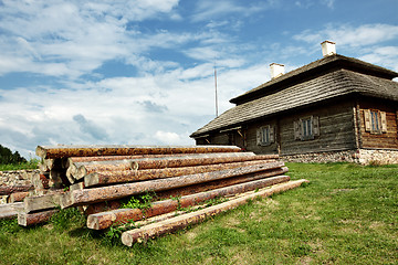 Image showing wooden cottage on green hill