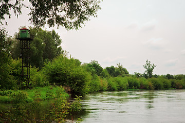 Image showing calm river with watchtower