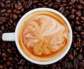 Image showing espresso cup in coffee beans