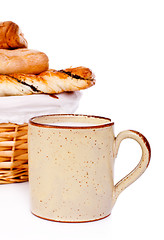 Image showing Bread Basket and Mug of Milk