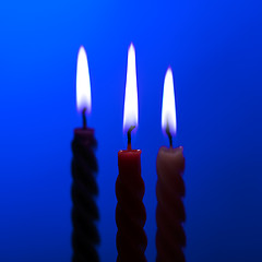 Image showing Three Candles On Blue