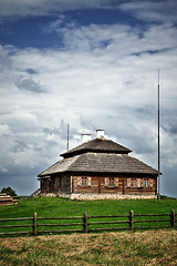 Image showing wooden cottage on green hill