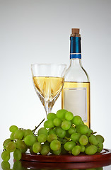 Image showing bottle and glass of wine, grape bunch