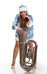 Image showing funny santa girl with big trumpet