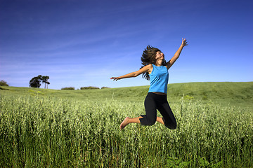 Image showing Jumping on a green field
