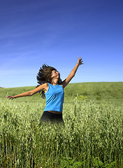 Image showing Jumping on a green field