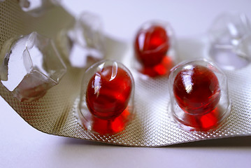 Image showing Red pills in blister package