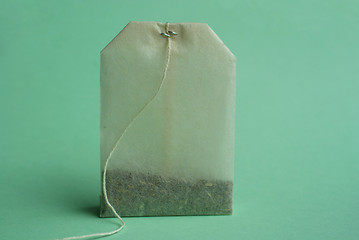 Image showing Tea bag over green