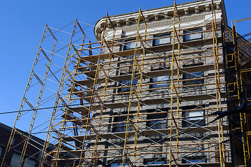 Image showing Old building under construction surrounded by scaffolding