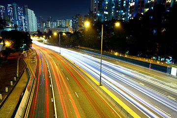 Image showing light trails in city at night